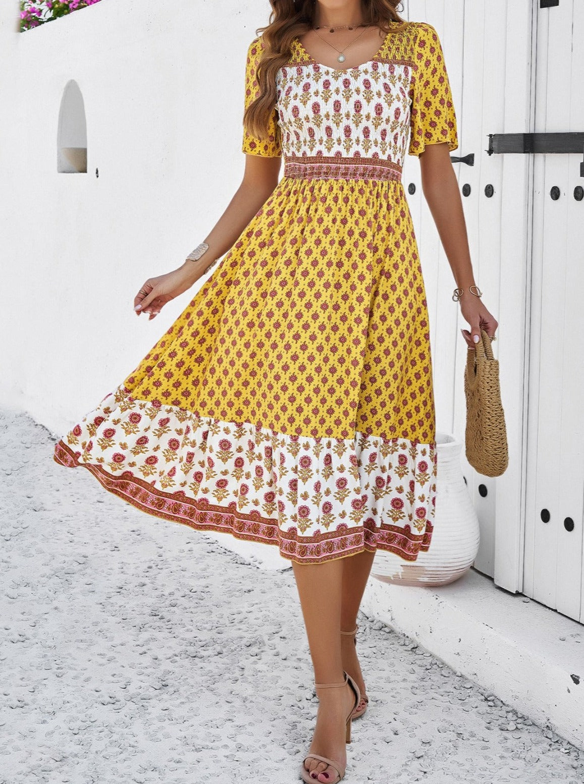 Elegant solkjole med retro-blomstret print